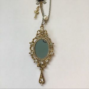 Betsey Johnson Necklace with long chain.